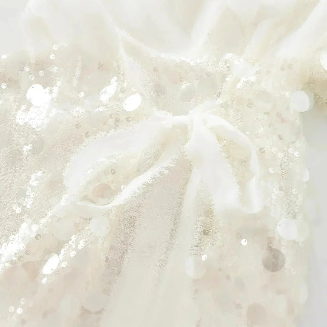 Mia Lange Pailletten Blouse met Wikkeldetail